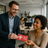 Boss handing a gift card to an employee