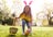 Happy child picking up an easter egg during easter egg hunt