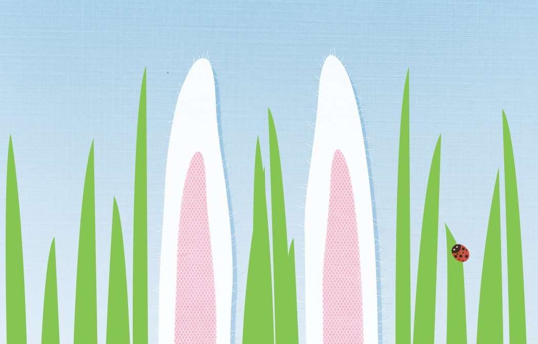 Pastel blue card with bunny ears and grass